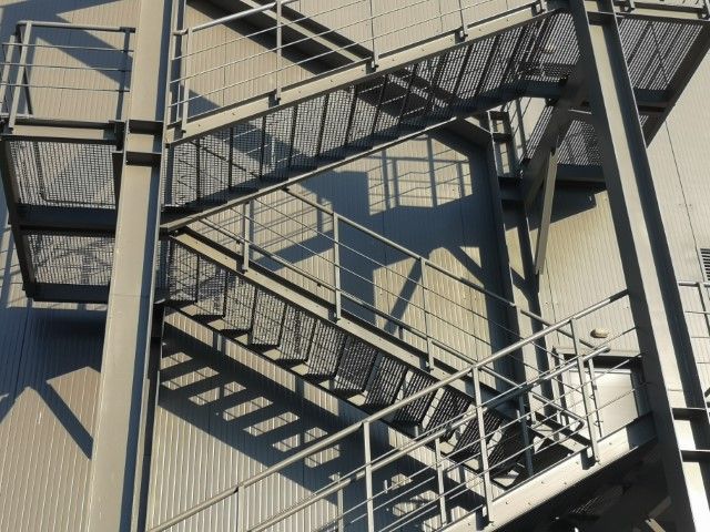Gray exterior fire escape in close-up view
