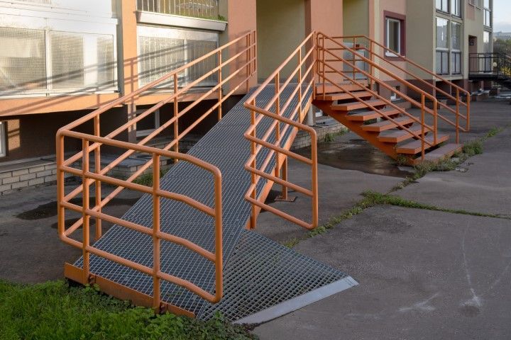 accessible wheelchair ramp with metal handrails in Conway apartment building for disabled individuals