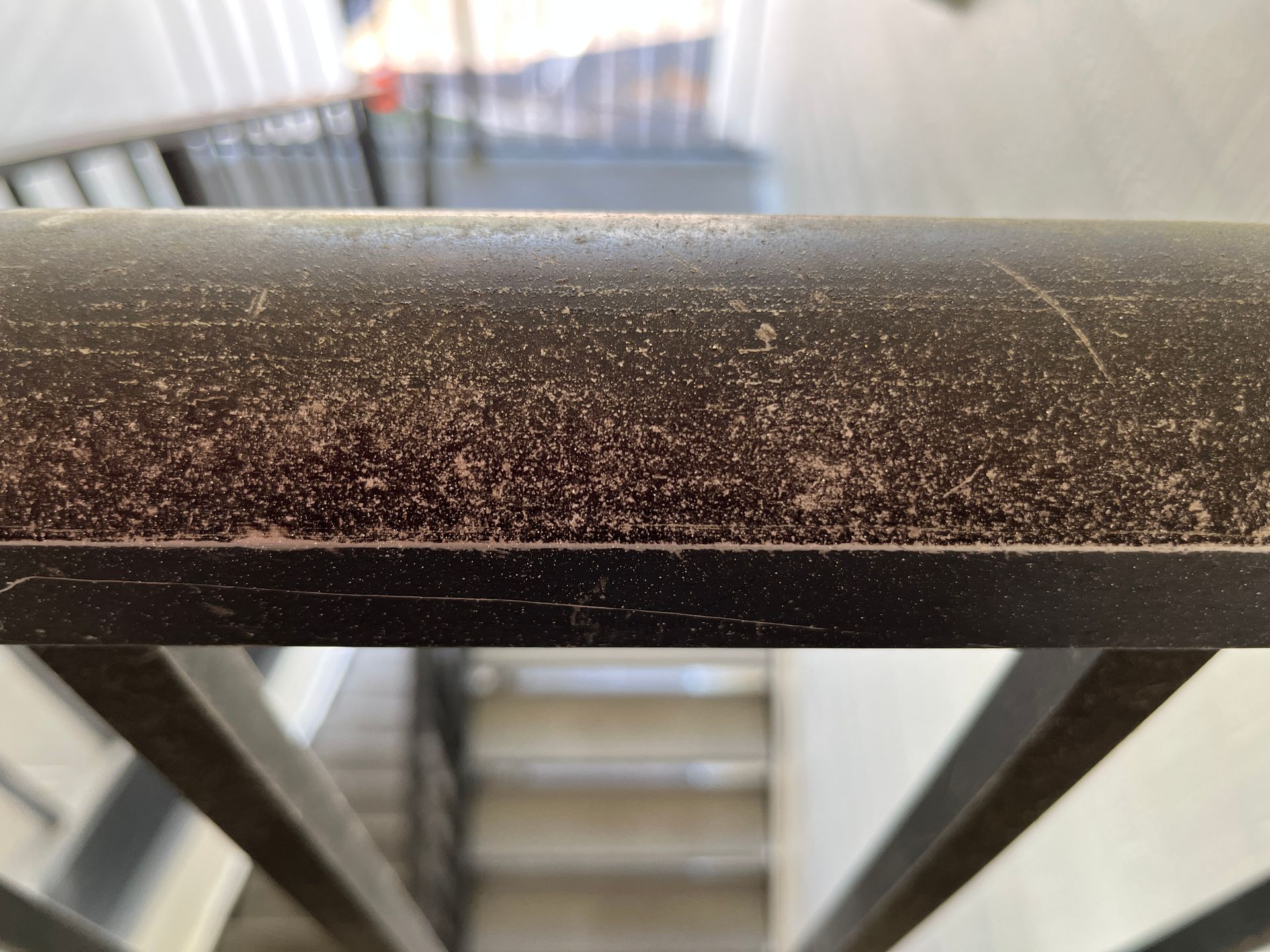 aluminum handrail at apartment with whie oxidation
