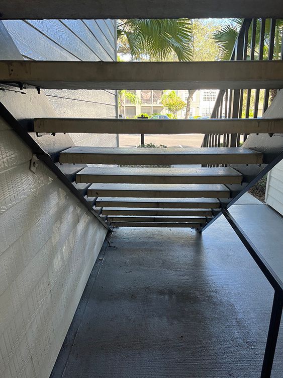 concrete treads bolted on steel apartment stair