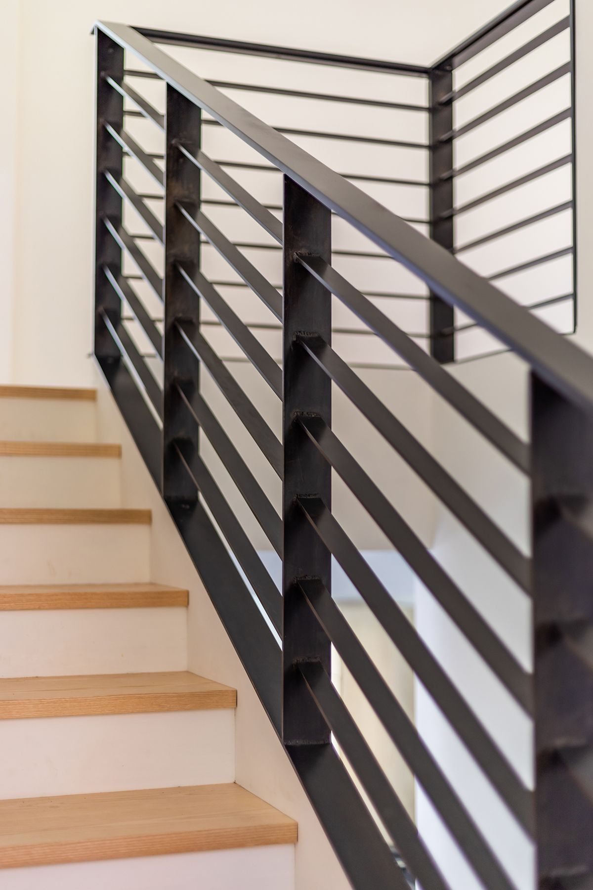 horizontal stair railing, black, modern welded on interior staircase