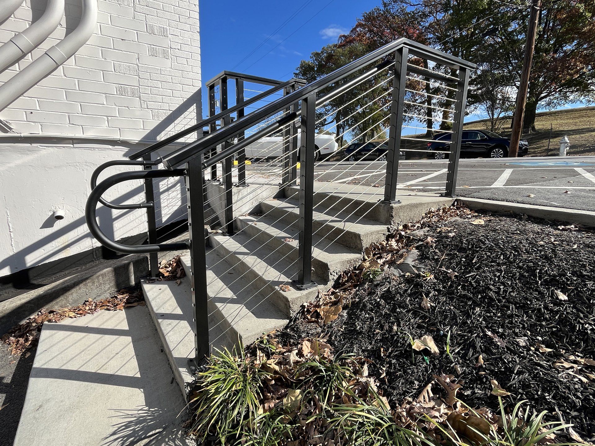 cable handrail built on small flight of stairs outdoor commercial retail space