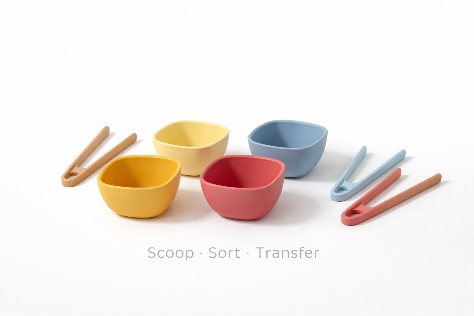 Four small, colorful bowls in yellow, red, and blue, accompanied by three matching plastic tongs for sorting activities.