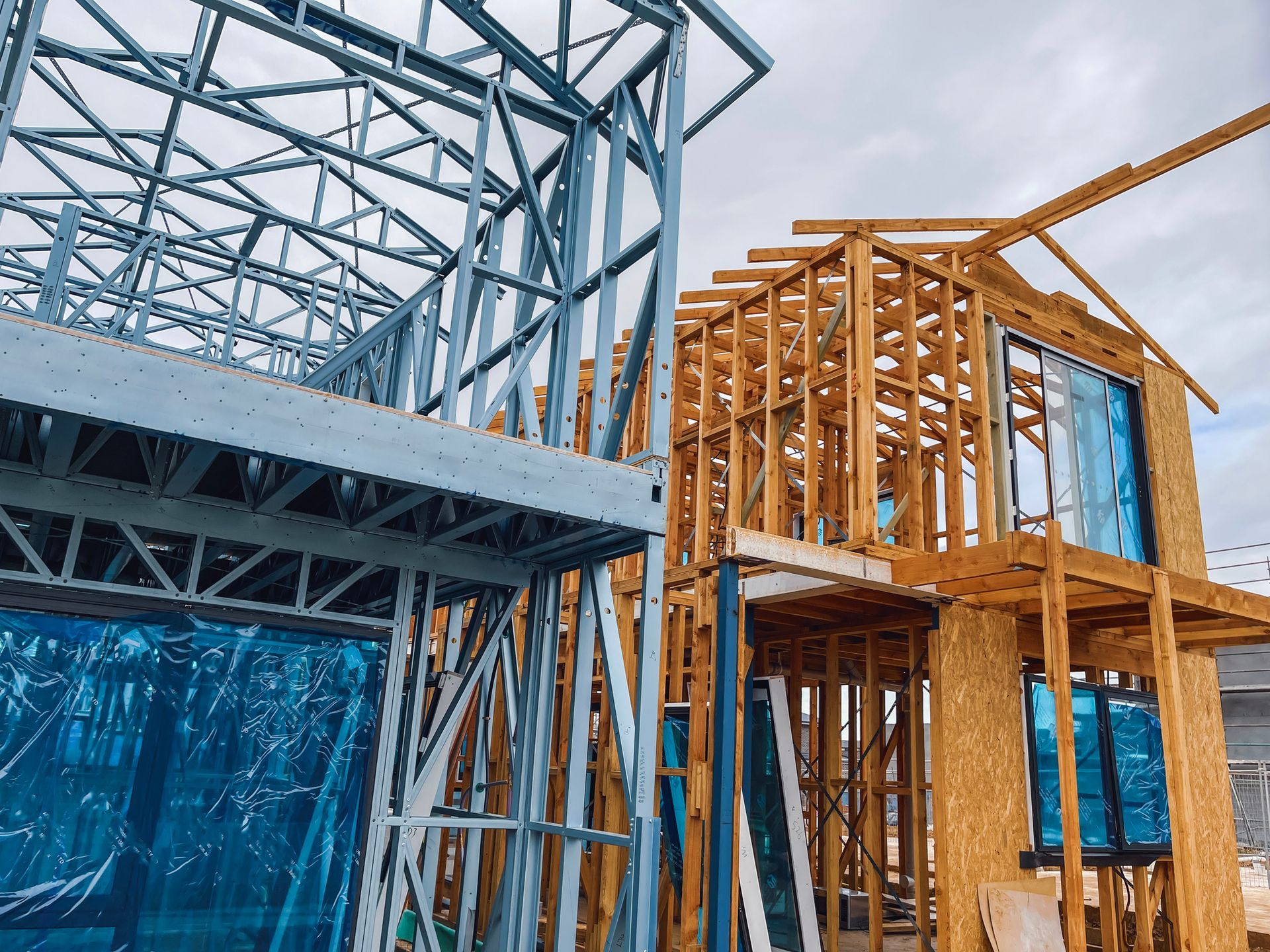 A house is being built with a lot of metal and wood.
