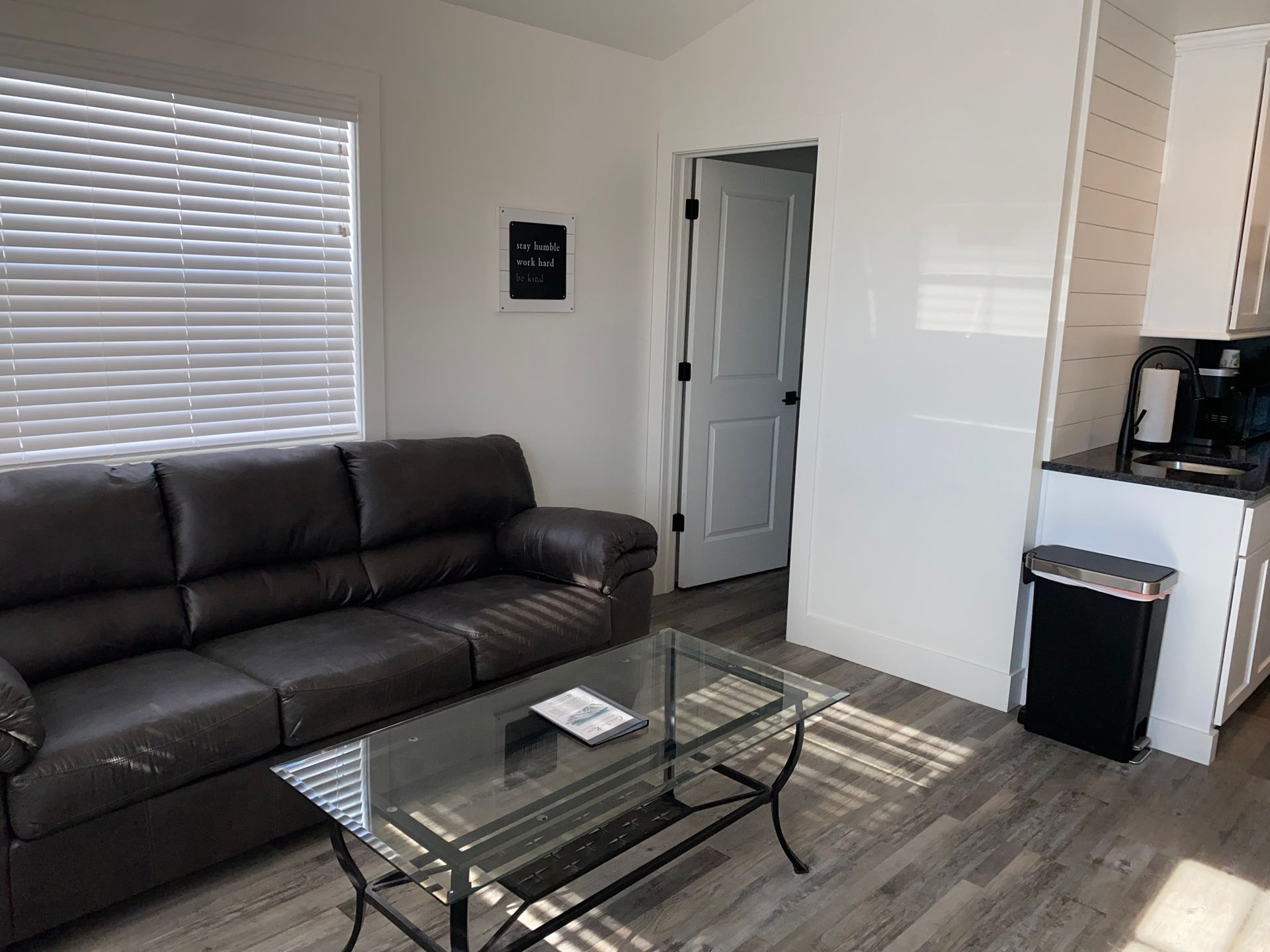 Living Room area with couch in Cabin 6 at Creek Side Resort