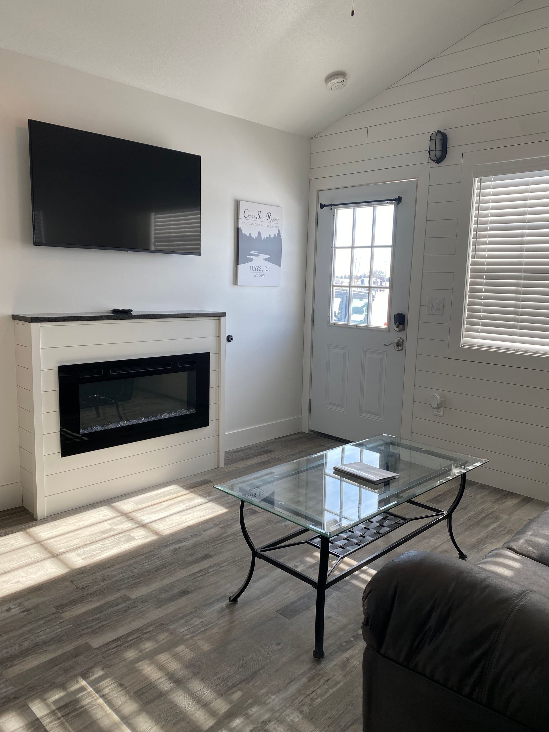 Living Room area with electric fireplace in Cabin 6 at Creek Side Resort