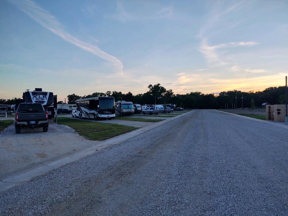 RVs parked on gravel pull through sites at Creek Side Resort
