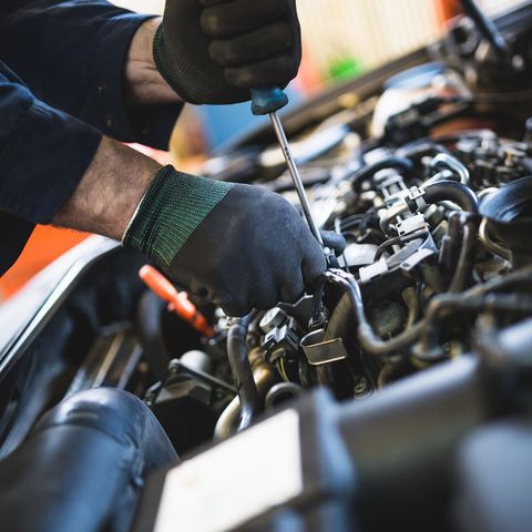 Mechanic Fixing Something on Car Engine — Fort Mill, SC — Toyota Techs