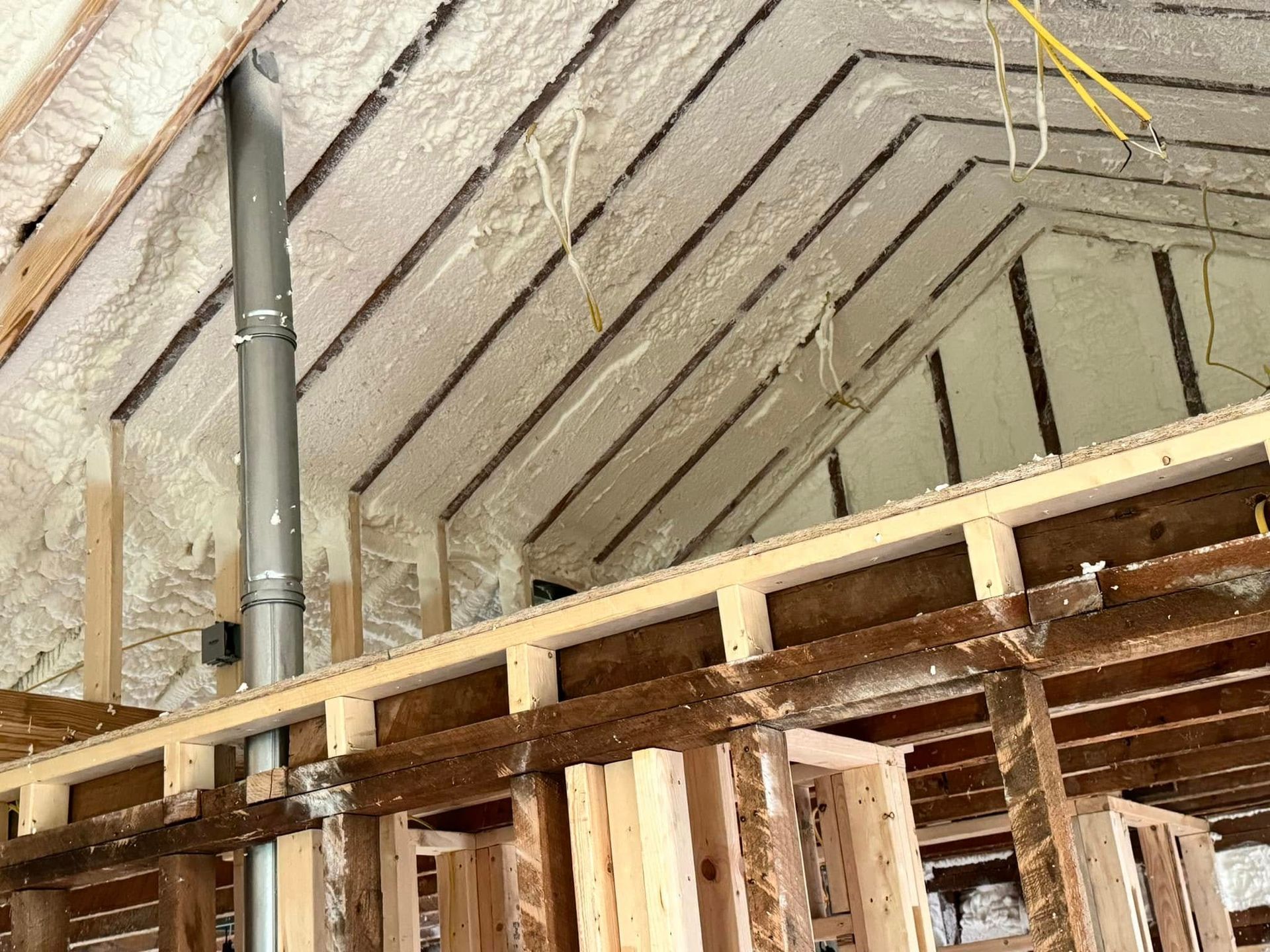 The ceiling of a building under construction is covered in foam.