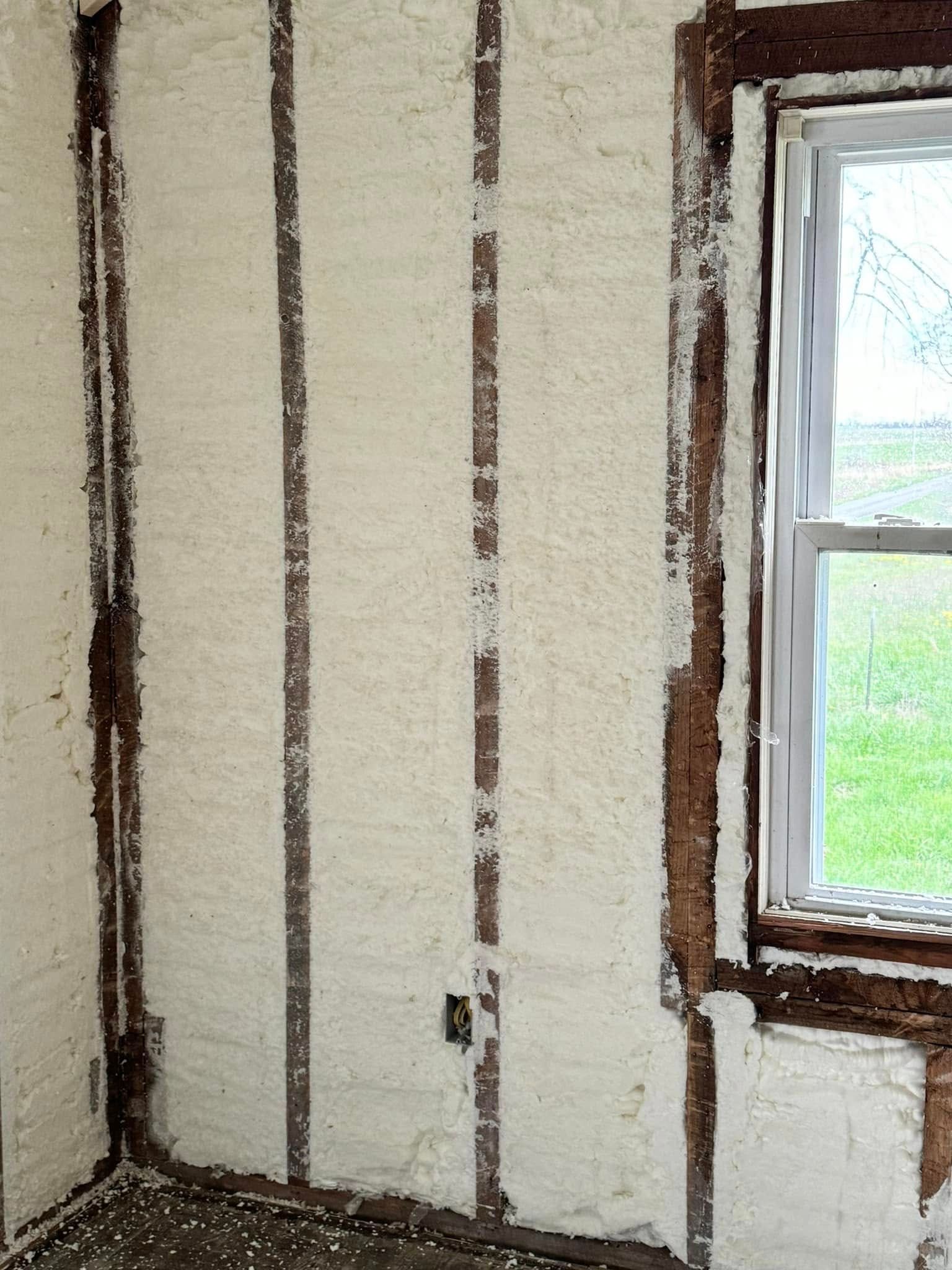 A room with a window and foam on the walls