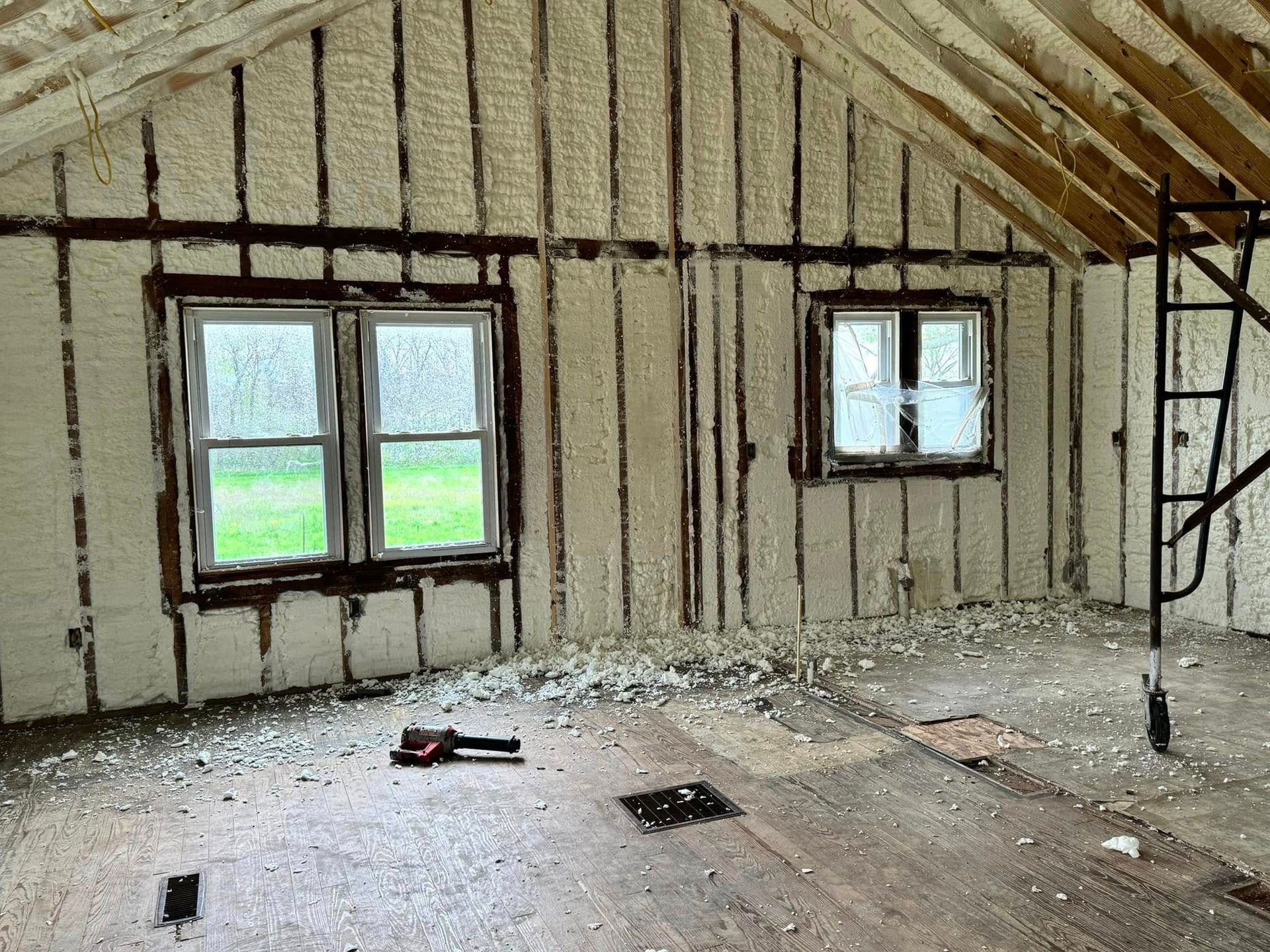 A room with a lot of foam on the walls and windows.