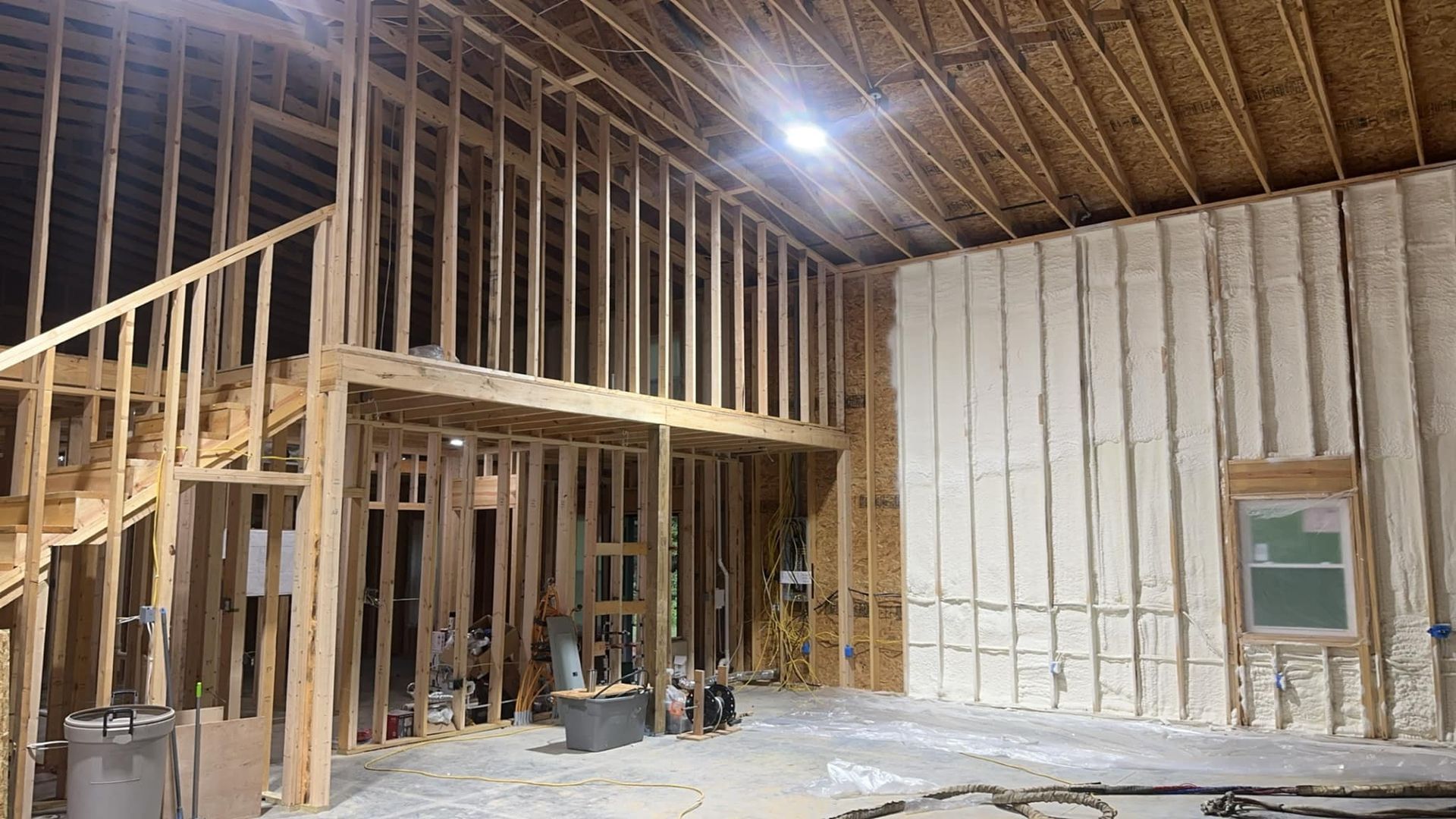 A house is being built with a lot of insulation on the walls.
