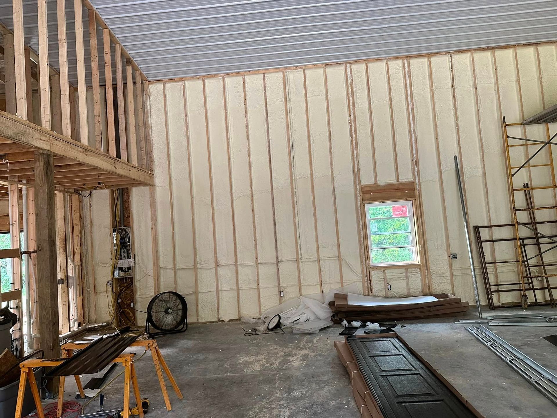 A room with a lot of foam on the walls and a fan.