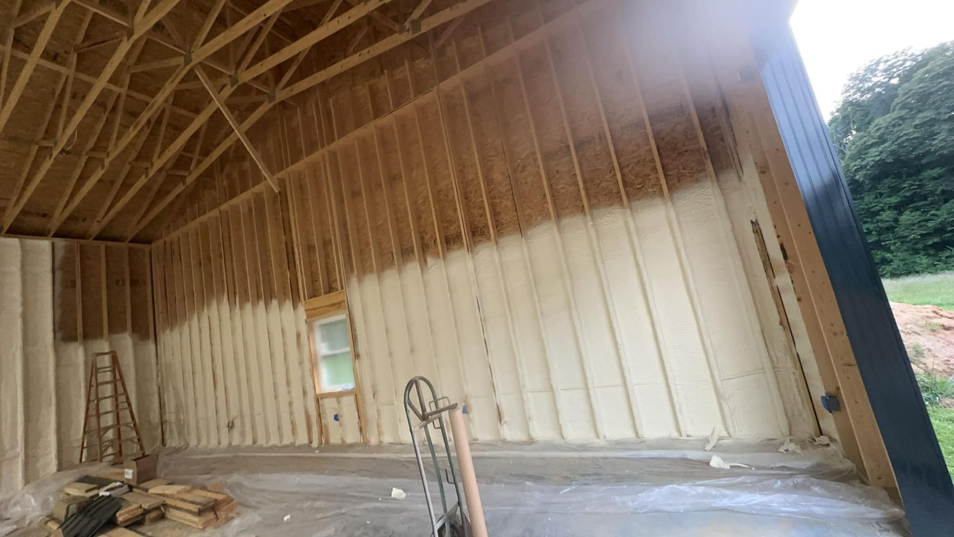 A garage is being insulated with spray foam.