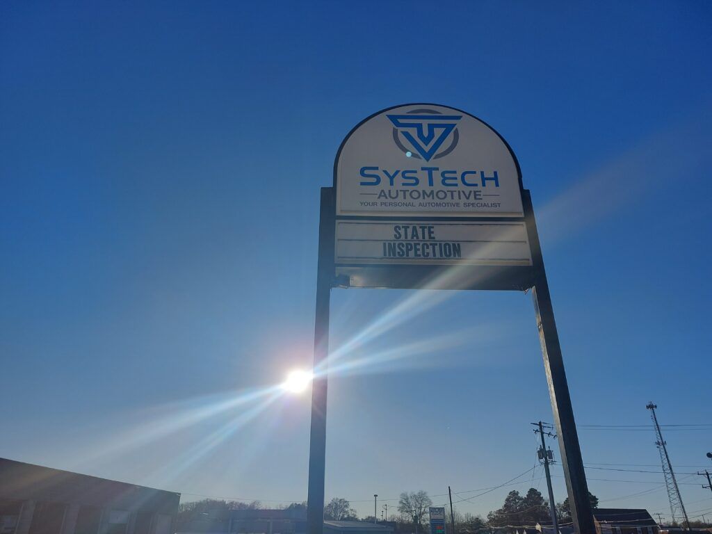 A system automotive sign with the sun shining through it