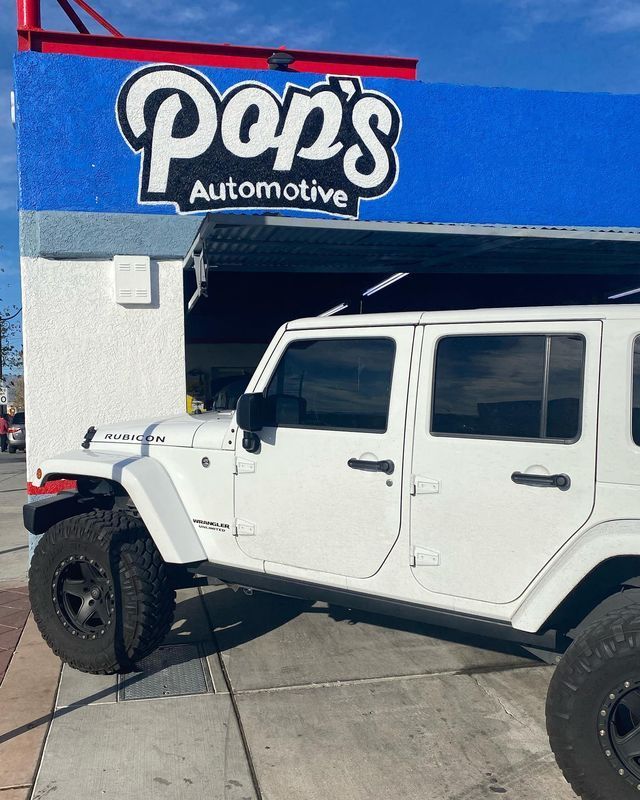 White Jeep parked outside