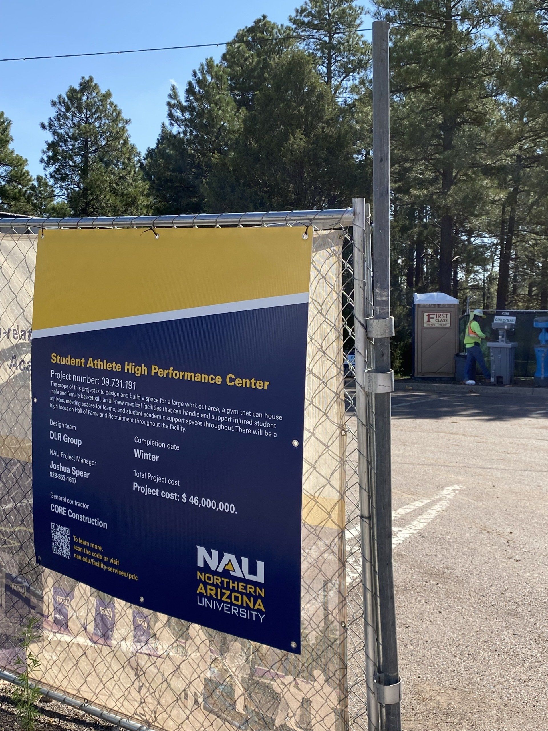 Portable restroom with poster | Flagstaff, AZ | First Class Sanitation