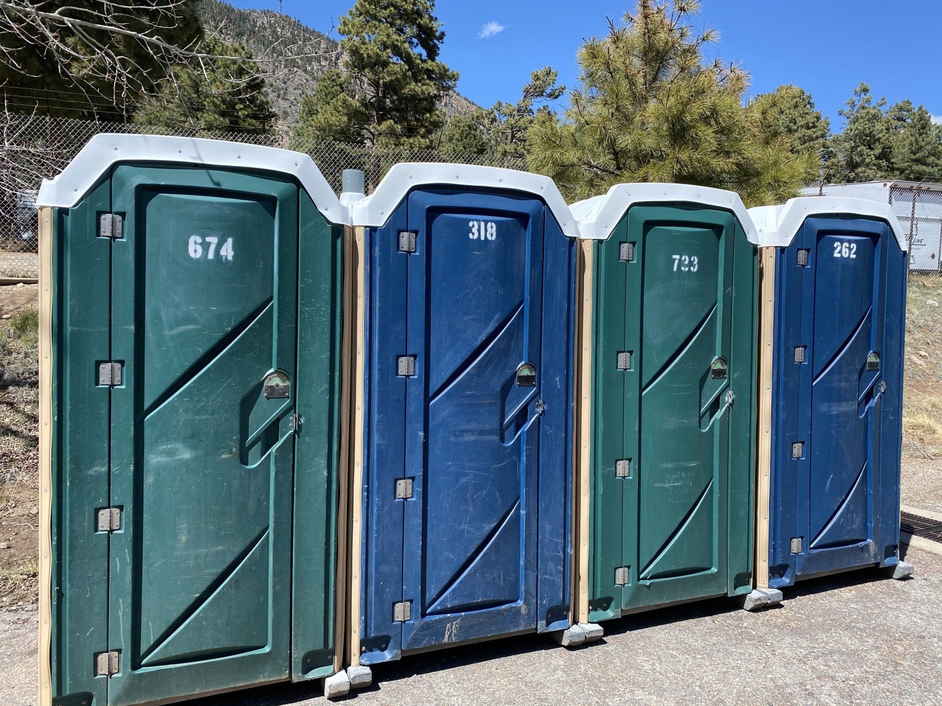 Portable restrooms with blue | Flagstaff, AZ | First Class Sanitation
