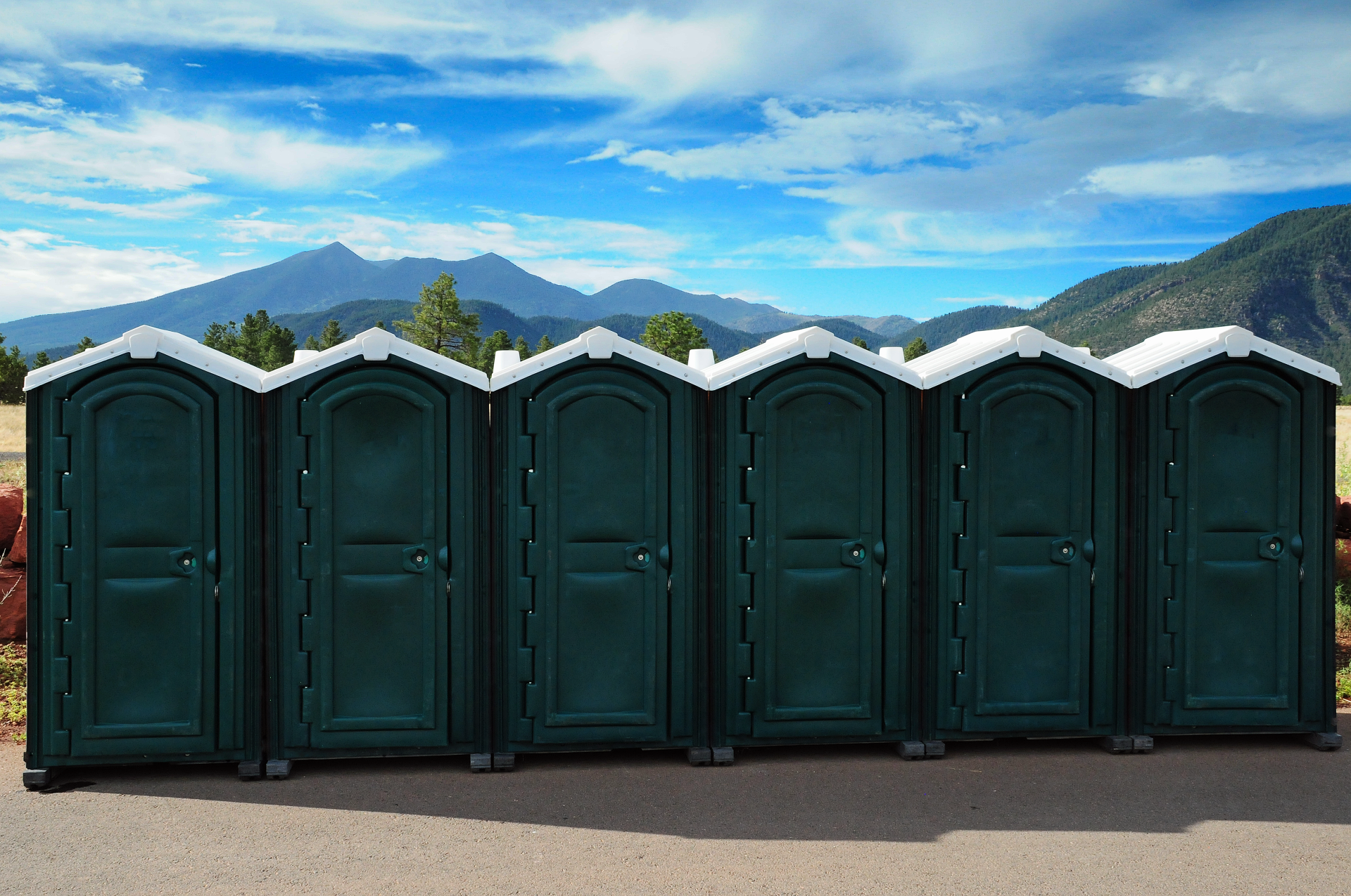 Portable restrooms with mountain | Flagstaff, AZ | First Class Sanitation