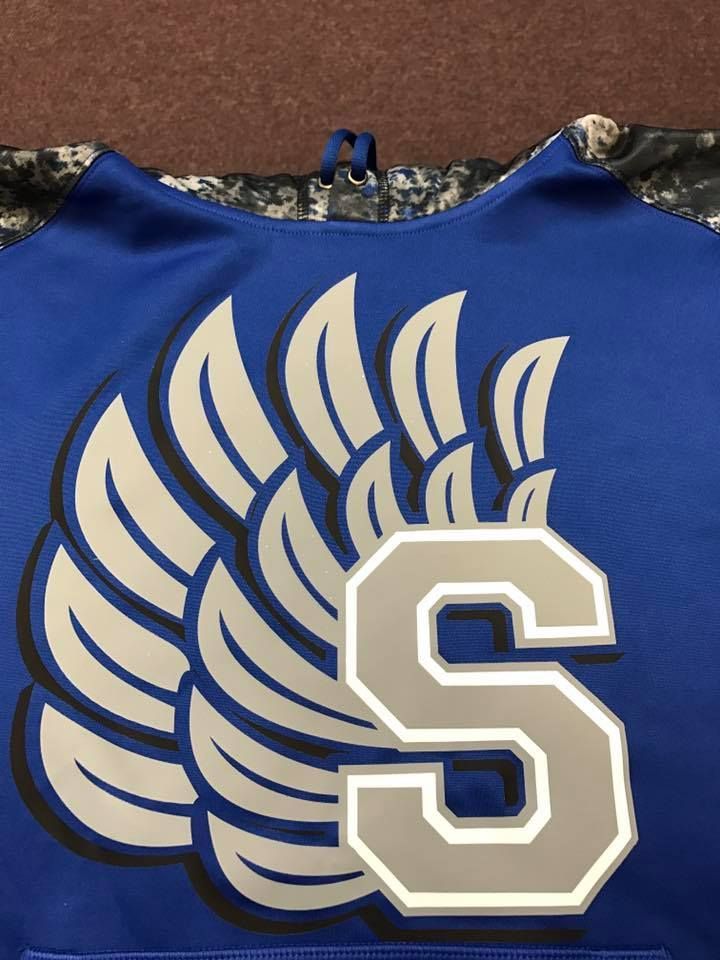 A blue shirt with the letter s on it