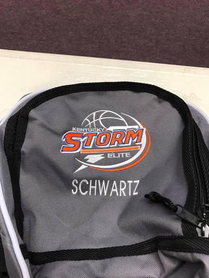 The inside of a backpack with the name schwartz on it.