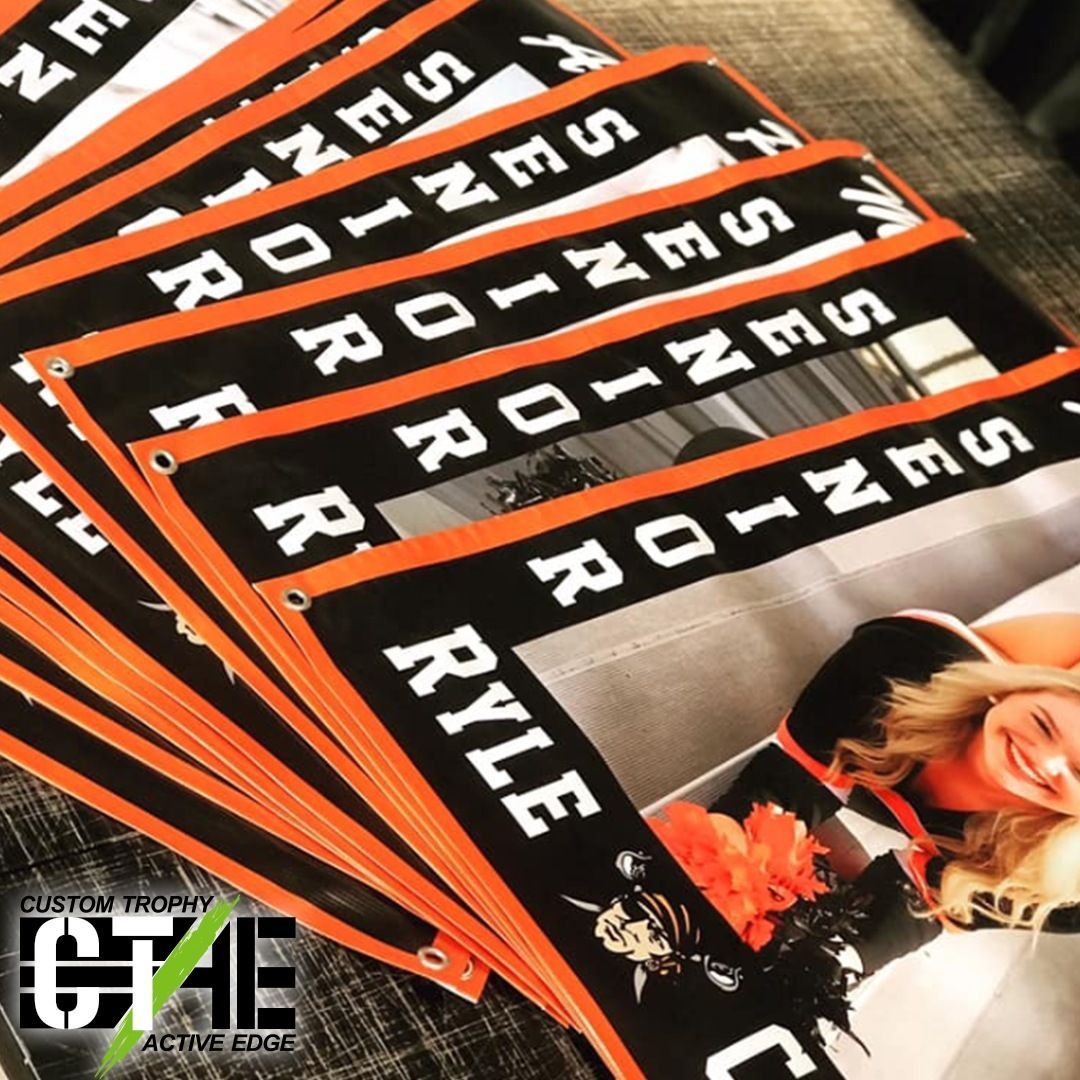 A stack of banners with the name ryle on them