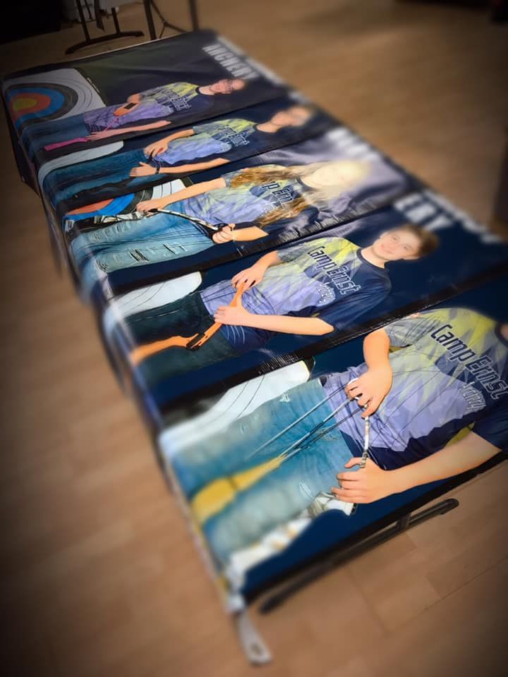 A table with a bunch of pictures of people on it