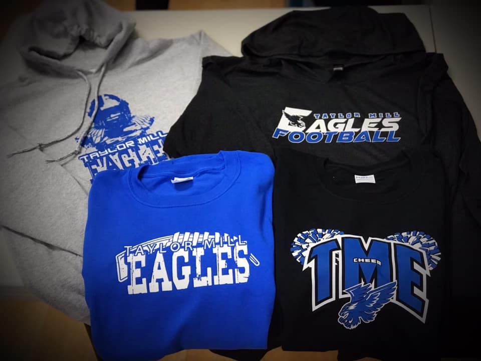 Three eagles football shirts are on a table