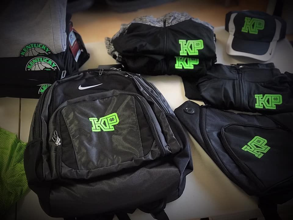 A black backpack with kp embroidered on it