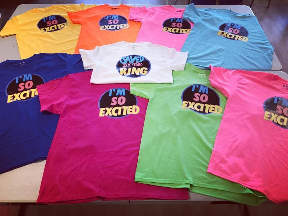 A bunch of t-shirts that say i 'm so excited
