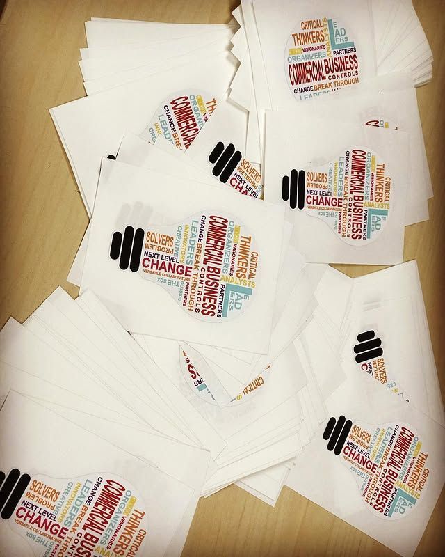 A bunch of papers with a light bulb and words on them