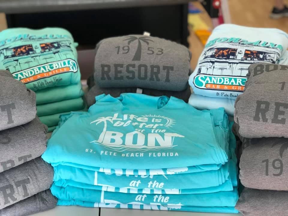 A stack of shirts with the word resort on them