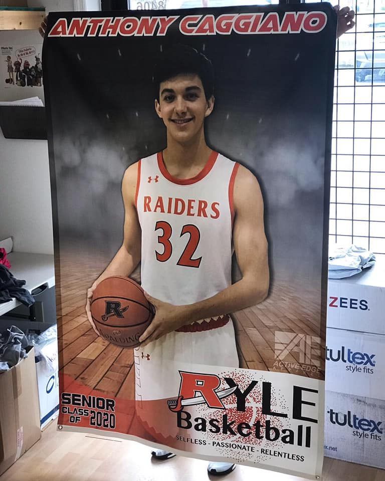 A poster of a basketball player holding a basketball.