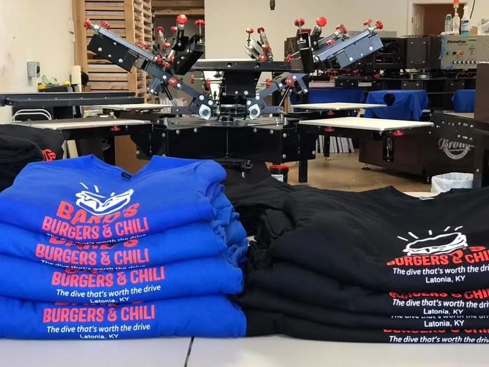 Blue and black t-shirts printed with