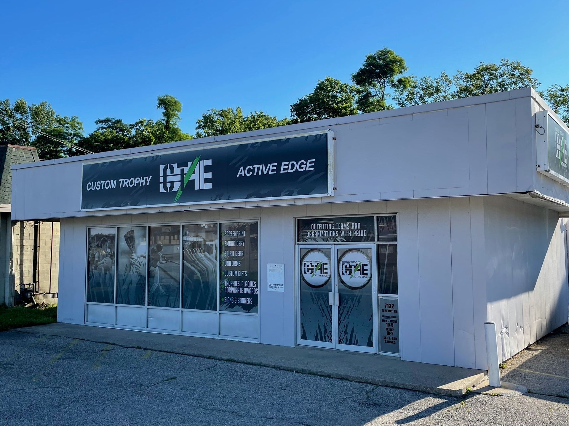 A white building with a sign that says game on it