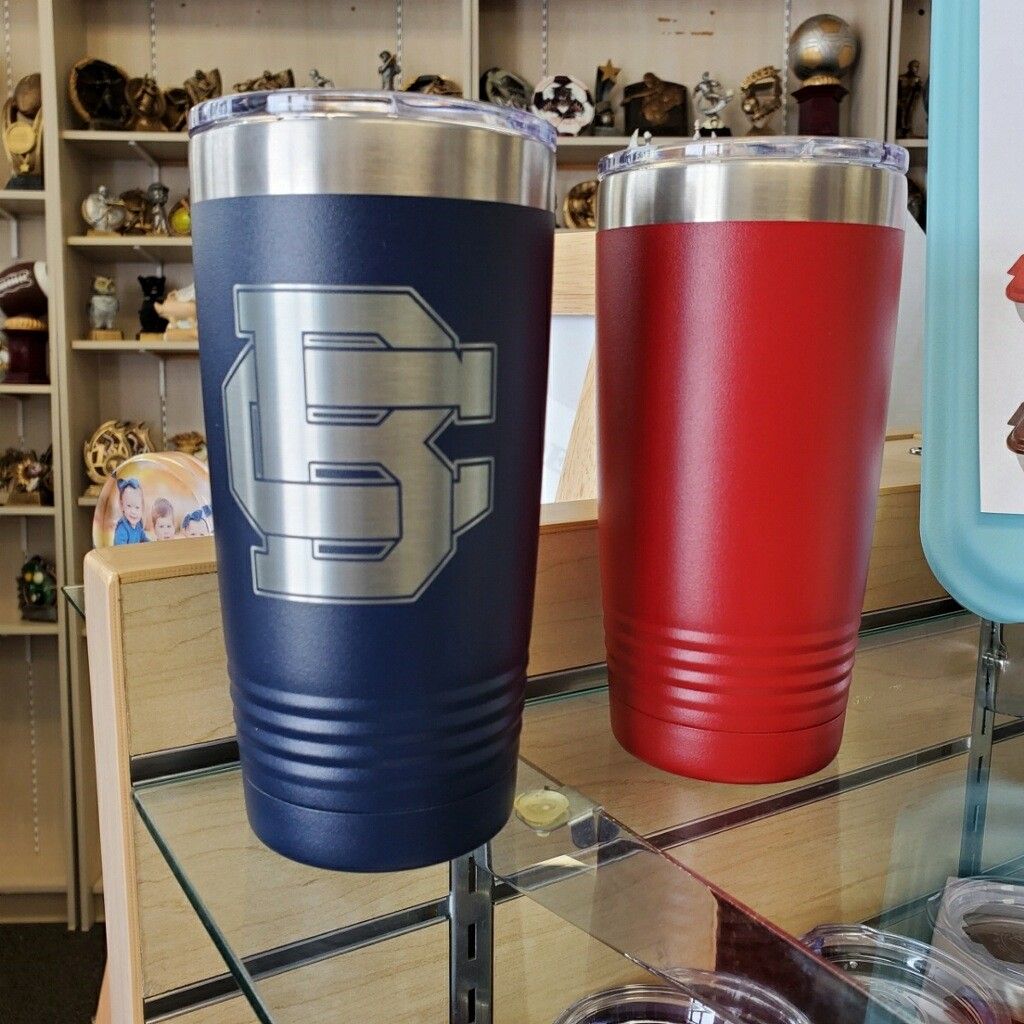 A blue and red tumbler with the letter e on it