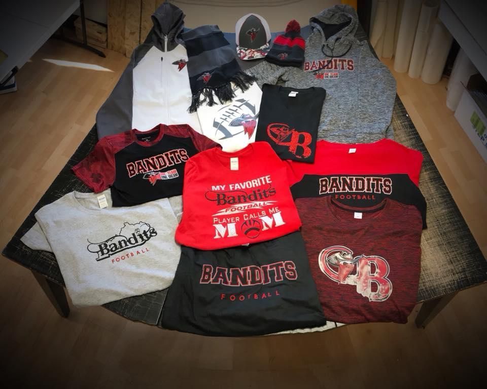 A bunch of shirts with one that says bandits on it