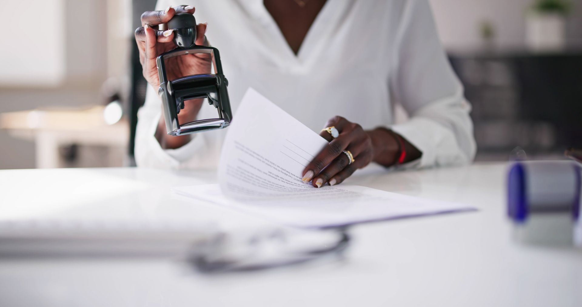 Person stamping a document