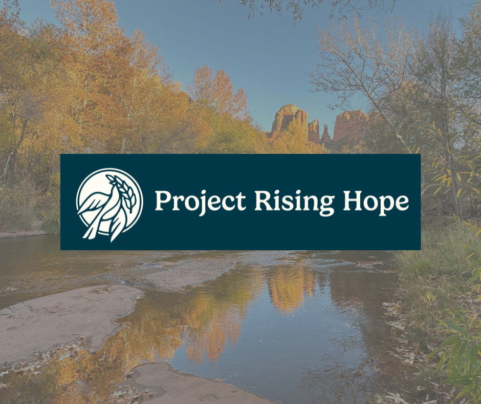 A person is holding a box full of food and a logo for fill the need