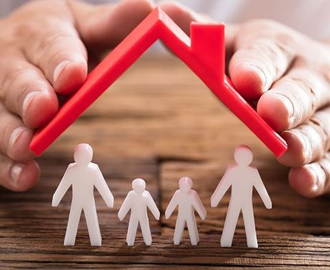 Person Protecting Family Figures — Kokomo, IN — David Akers Insurance