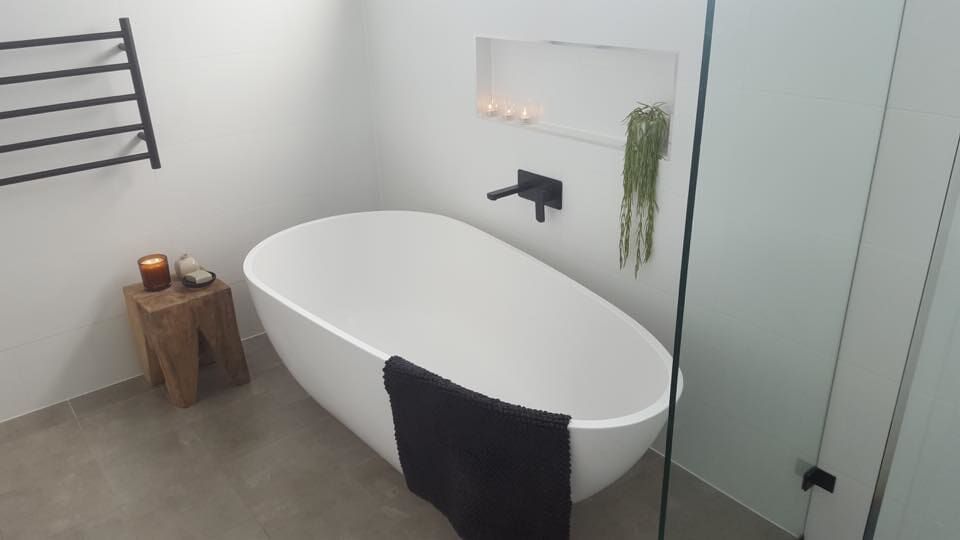 A Bathroom With A Bathtub And A Shower — Custom Design Bathroom Renovations in Port Macquarie, NSW