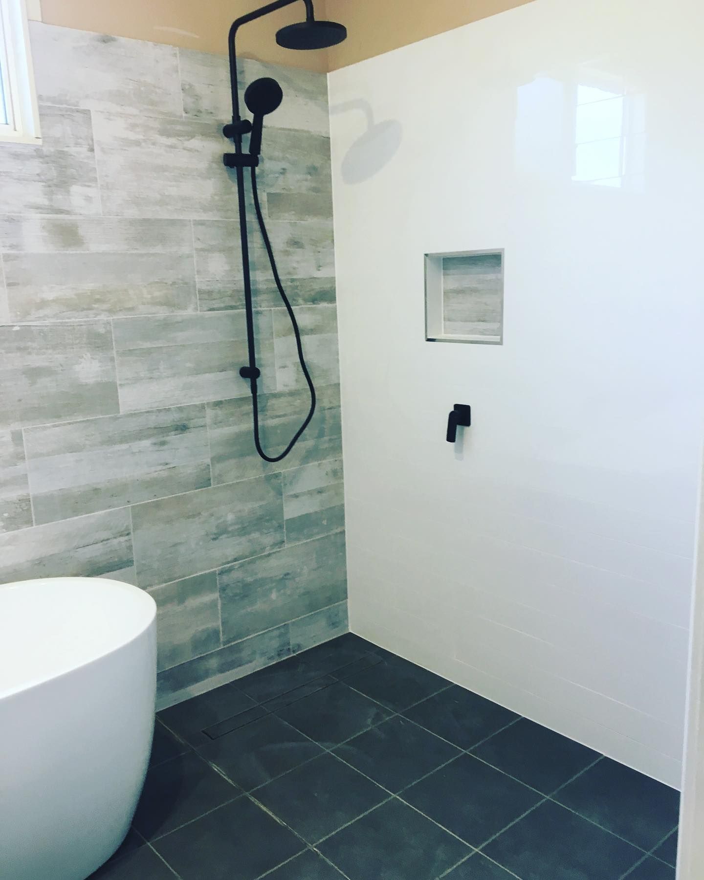 A Bathroom With A Walk In Shower And A Bathtub — Custom Design Bathroom Renovations in Port Macquarie, NSW