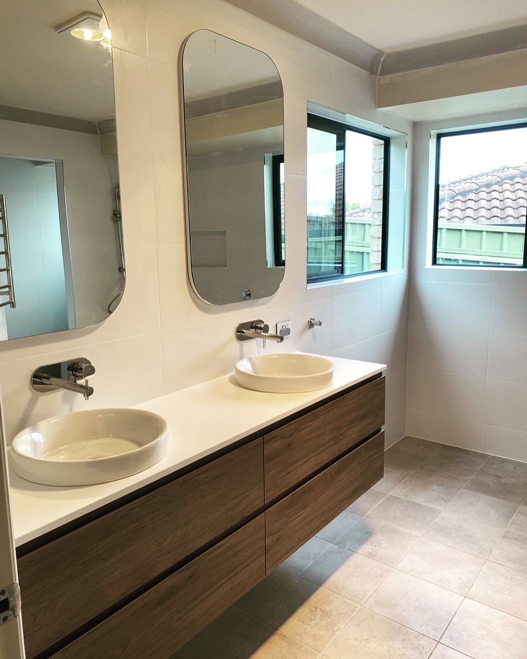 A Bathroom With Two Sinks And Two Mirrors — Custom Design Bathroom Renovations in Port Macquarie, NSW