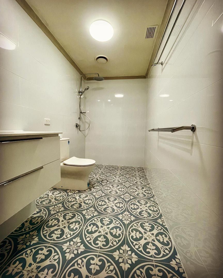 A Bathroom With A Toilet, Sink, And Shower — Custom Design Bathroom Renovations in Port Macquarie, NSW
