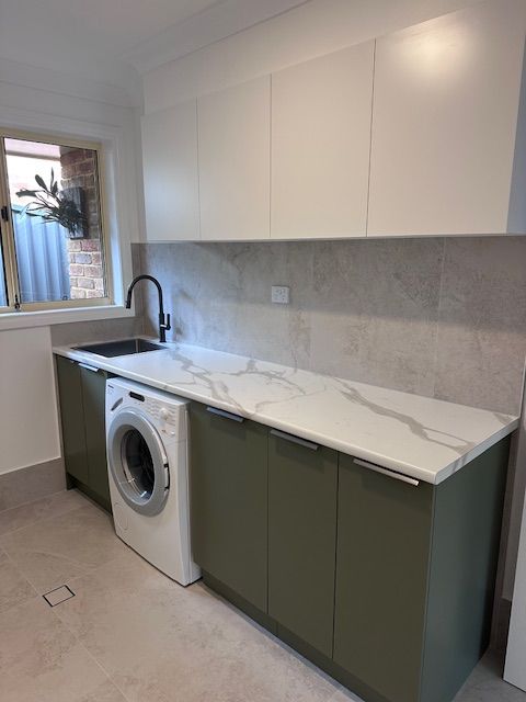 Laundry Room With White Upper Cabinets — Custom Design Bathroom Renovations in Port Macquarie, NSW