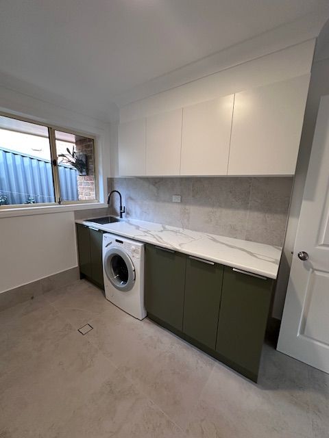 Laundry Room With Olive Green Cabinets — Custom Design Bathroom Renovations in Port Macquarie, NSW