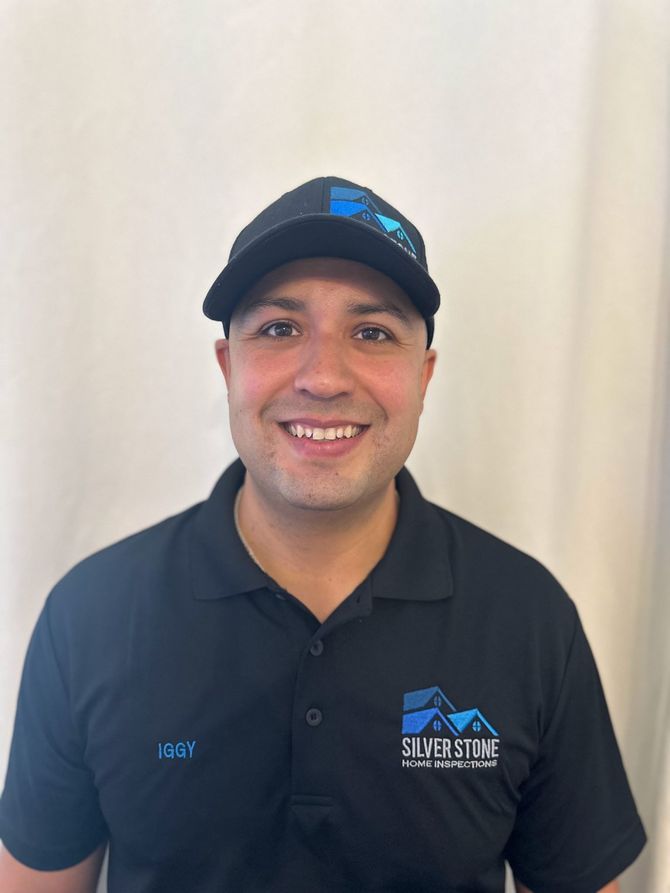 A man wearing a black shirt with the name johnny on it