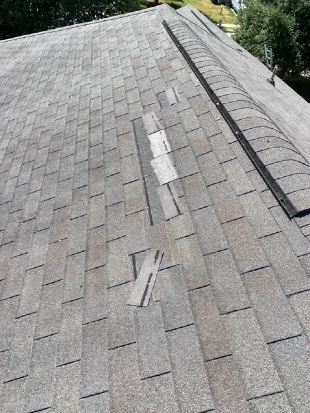 A close up of a roof with a hole in it.