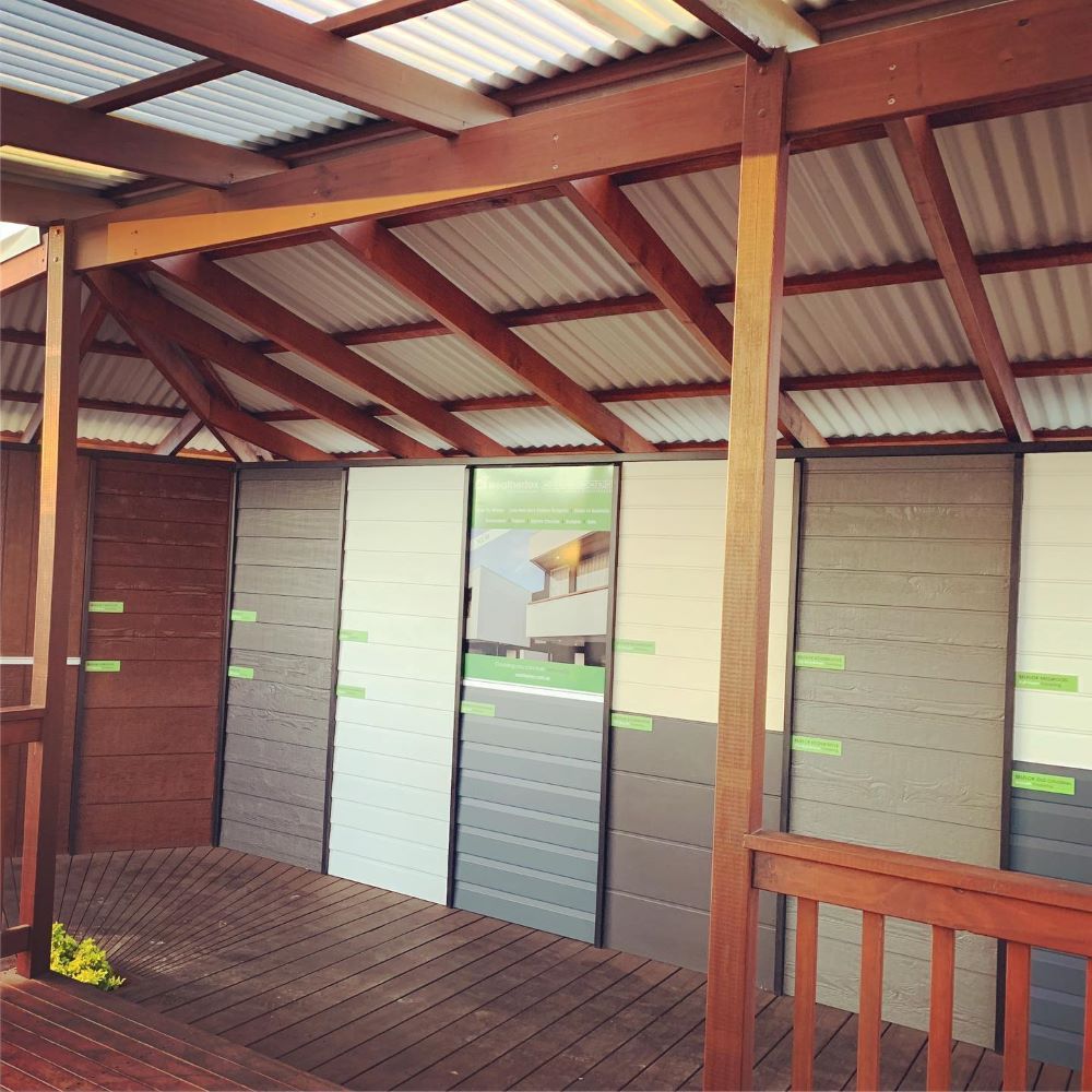 A Wooden Shelter Displaying Various Color Samples of Siding on A Deck — Express Timber Solutions In Long Jetty, NSW