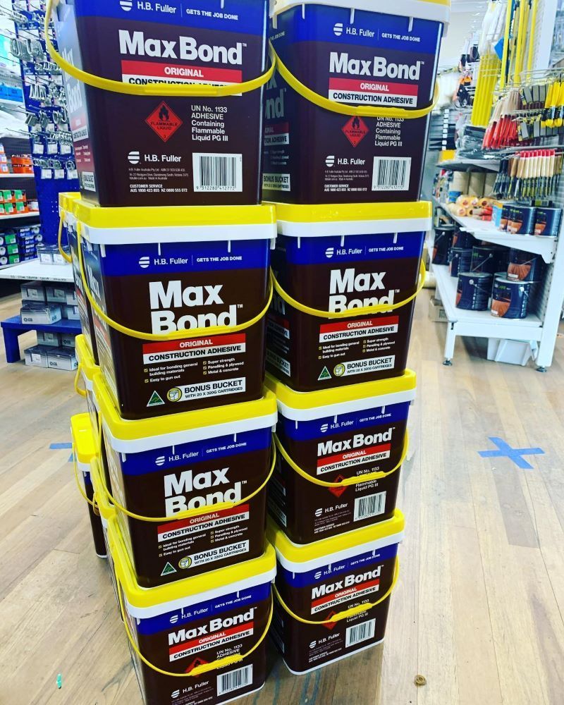 A Stack of Max Bond Adhesive Buckets in A Hardware Store — Express Timber Solutions In Long Jetty, NSW